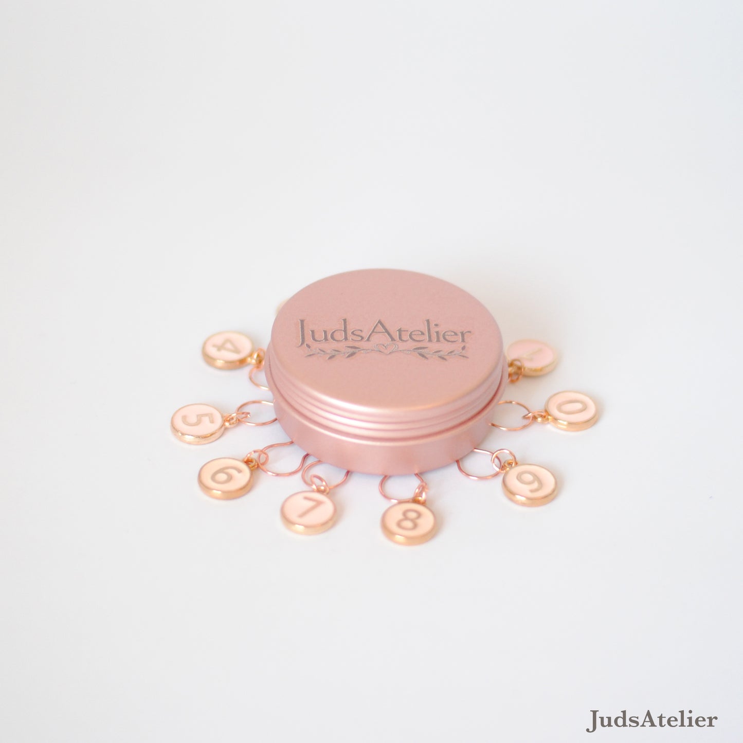Marcadores de puntos números en tono rosa